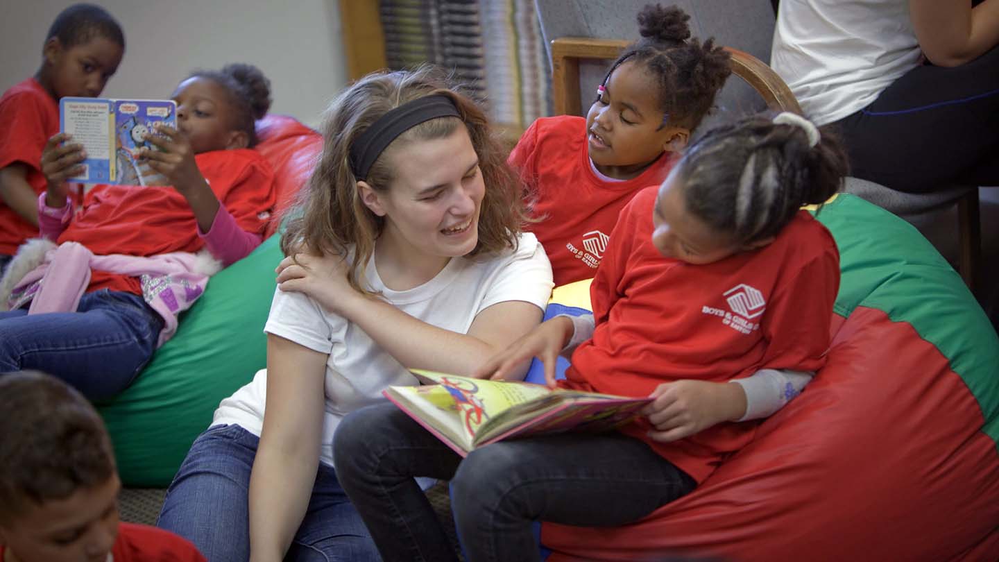 Emily Emick í20 helps a child read at the Boys and Girls Club of Easton. Over the weekend, more than 150 students, faculty, and staff volunteered for service projects throughout the Easton community during the annual Make a Difference Day. Hosted by the Landis Center and the Center for Community Engagement, the dayís projects benefited the Boys and Girls Club of Easton, Children's Home of Easton, Firth Youth Center, The Journey Home, Nurture Nature Center, Spring Garden Early Learning Center, Third Street Alliance, and various community gardens. The work varied from painting, to landscaping, to light construction. Ken White/Zovko Photographic LLC Oct. 22, 2016